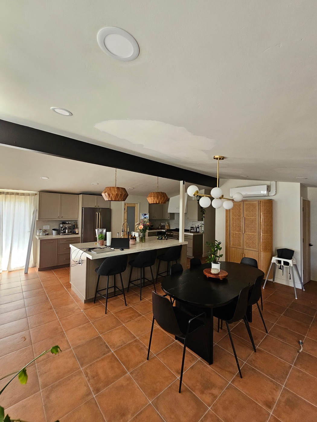 Open-concept kitchen and dining room with pendant lighting
