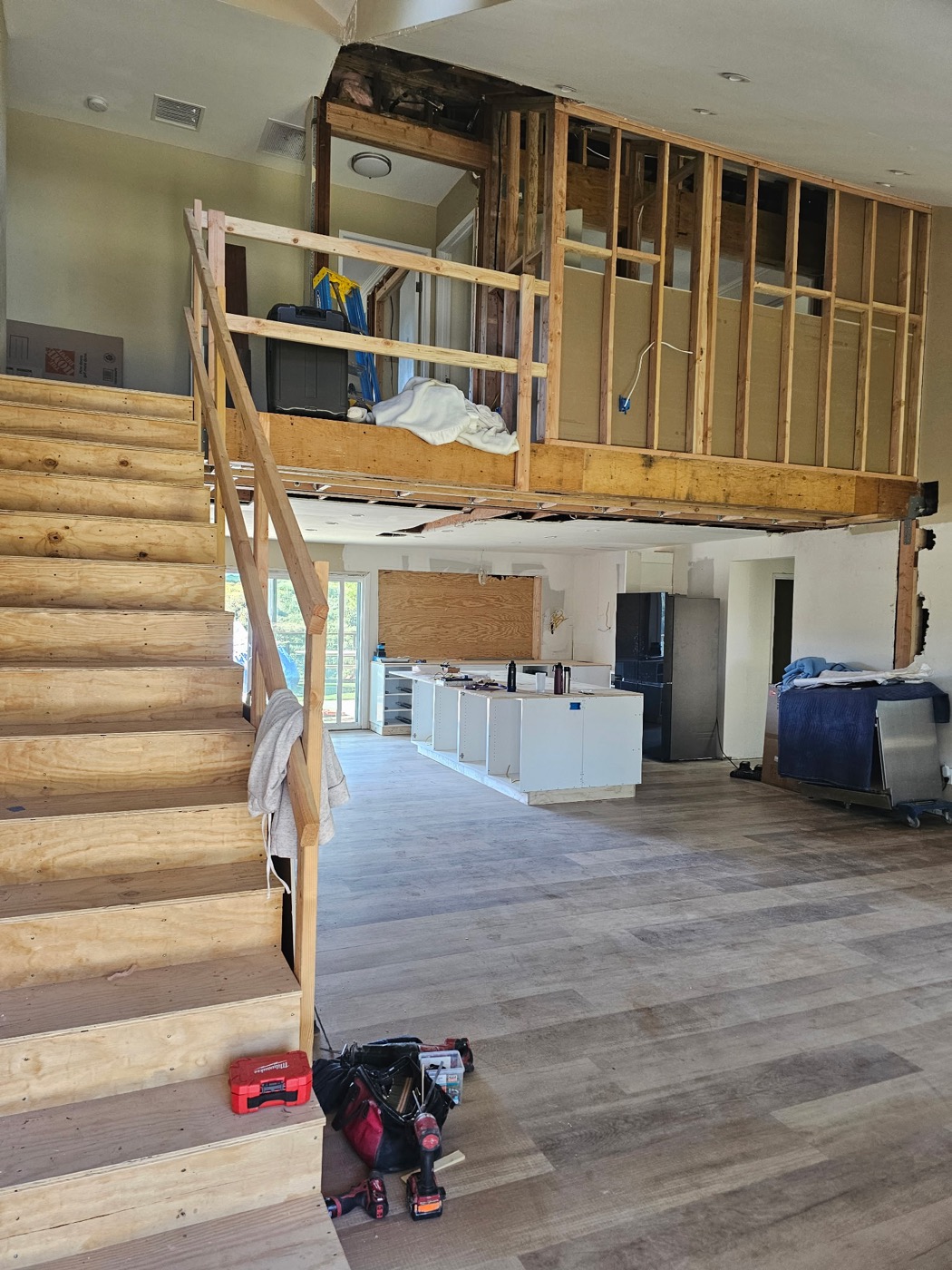 Multi-level home remodel with open staircase and new kitchen