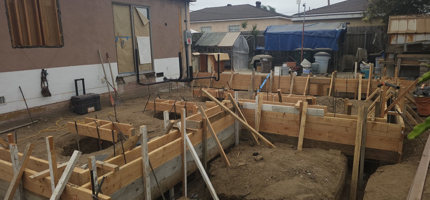 Foundation footing with rebar and wood form work