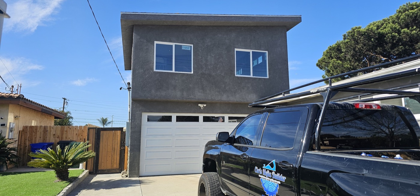 Completed two-story new build exterior with garage
