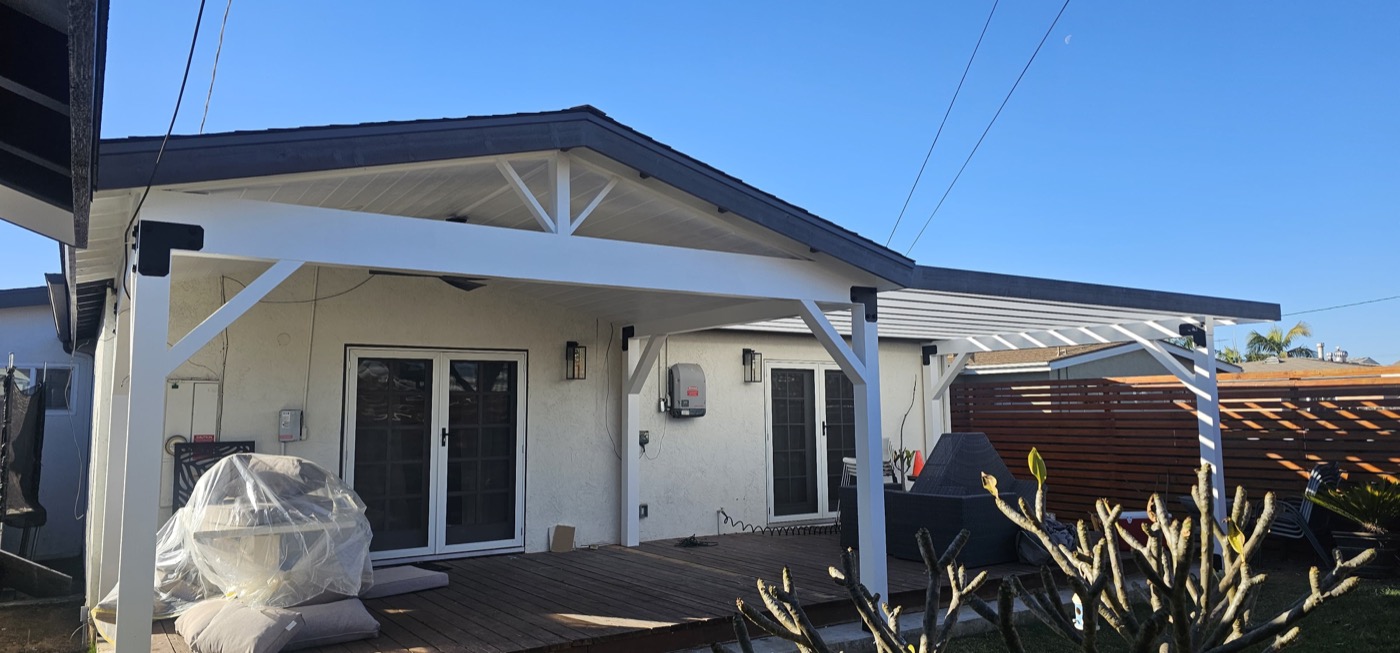 Covered patio addition with pergola and sliding glass doors